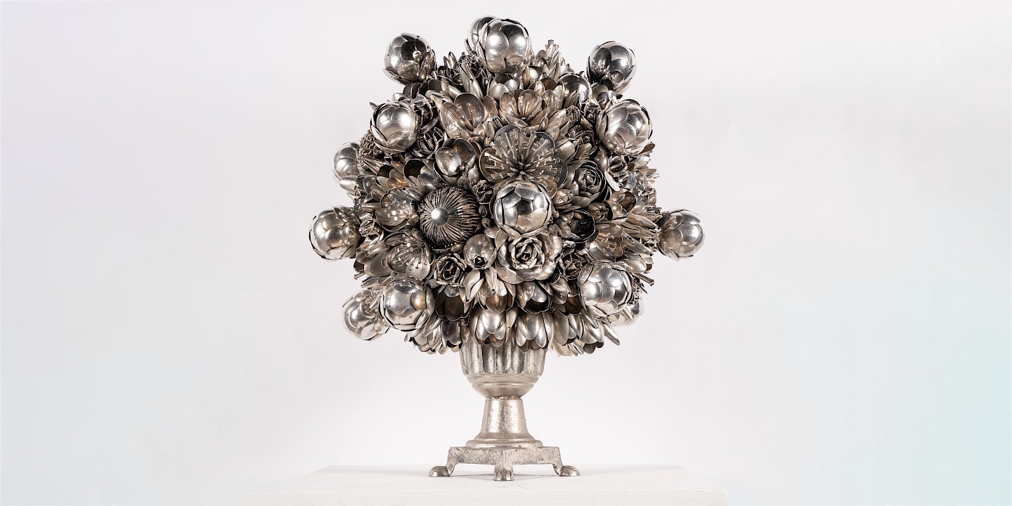 A silver flower bouquet of forks and spoons.