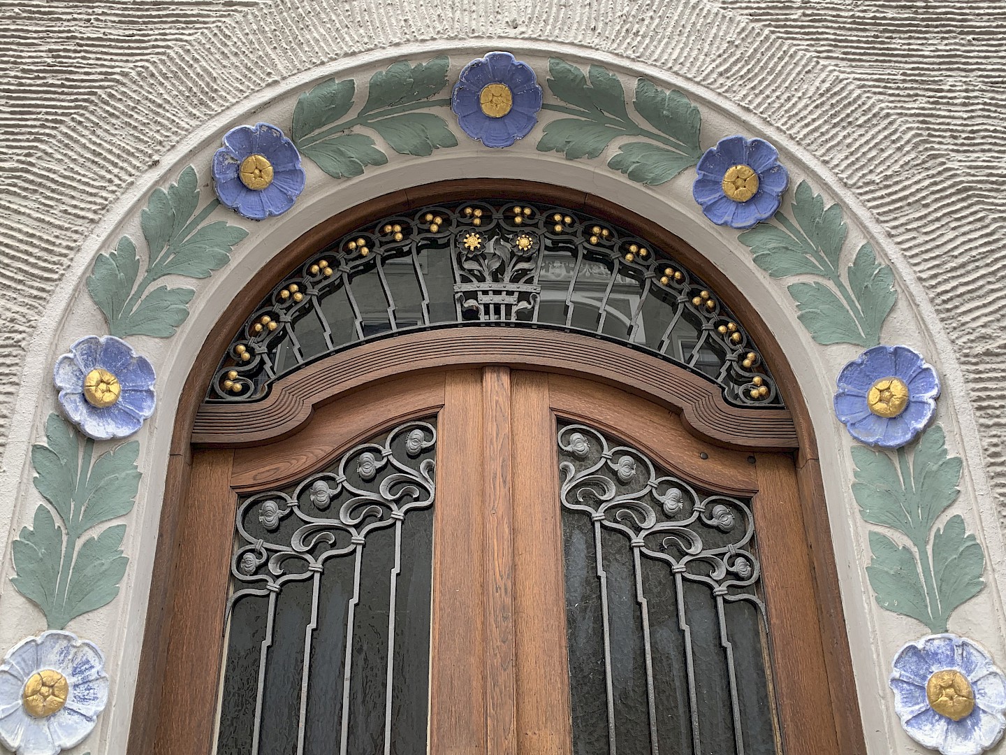 Typical floral decorative arch and ornate door in Schwabing