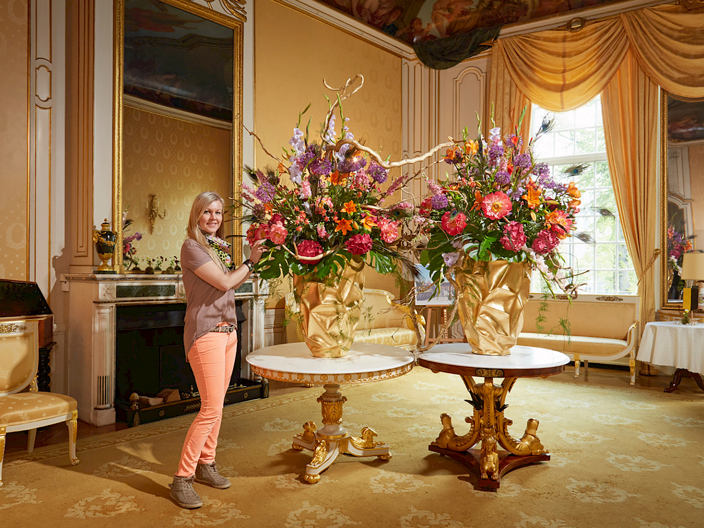 Florist Victoria Salomon with two of her creations