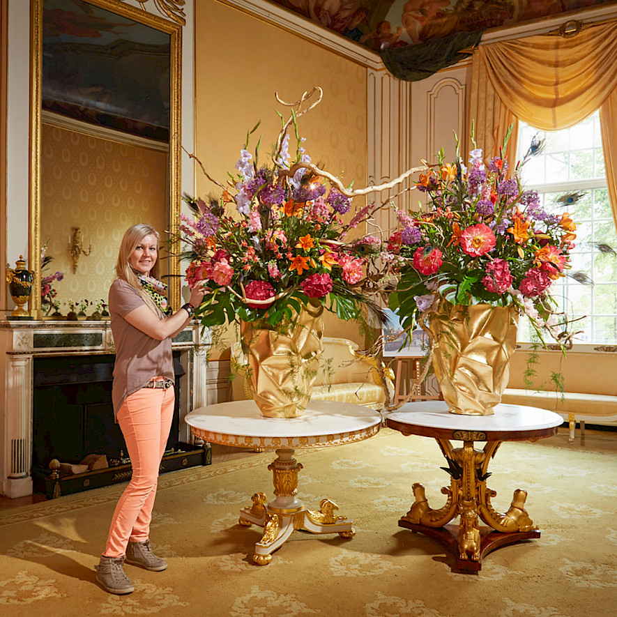 Florist Victoria Salomon with two of her creations