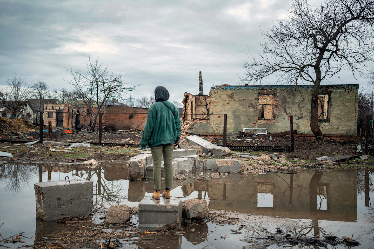Destruction of civilian residential areas is part of the Russian military strategy after the attempt of complete occupation of Ukraine. A young woman looks at a destroyed settlement after the recapture of the city of Chernihiv in northeastern Ukraine.
